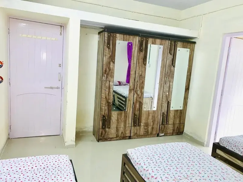 Spacious Triple Sharing Girls PG Room with Mirror Wardrobes in Navrangpura