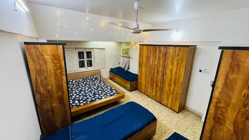 Spacious Twin Bed Sharing Room Interior at City House Girls Hostel in Ahmedabad