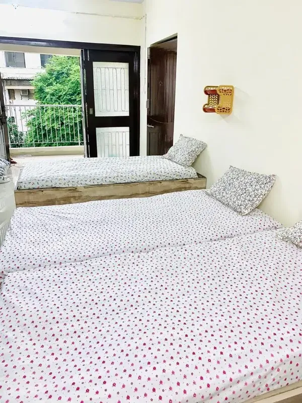Cozy PG Room for Girls with Attached Balcony View in Navrangpura